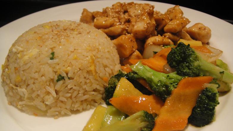 Lunch hibachi plate with chicken, vegetables, and fried rice.