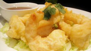 Crispy honey shrimp on a bed of lettuce with small soup bowl