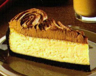 Baileys cheesecake sitting on a metallic plate.